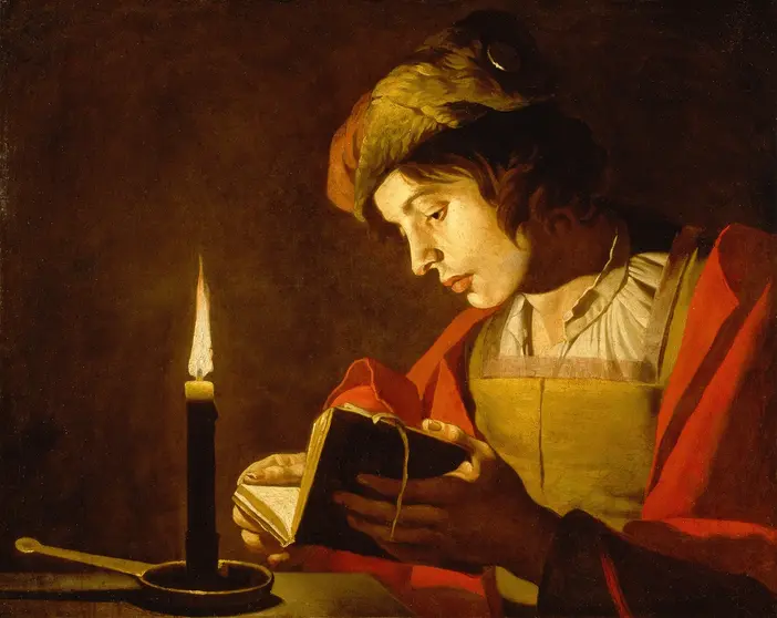 Giovane uomo che legge alla luce di una candela, dipinto ad olio di Matthias Stom, circa 1630. Voglia di studiare